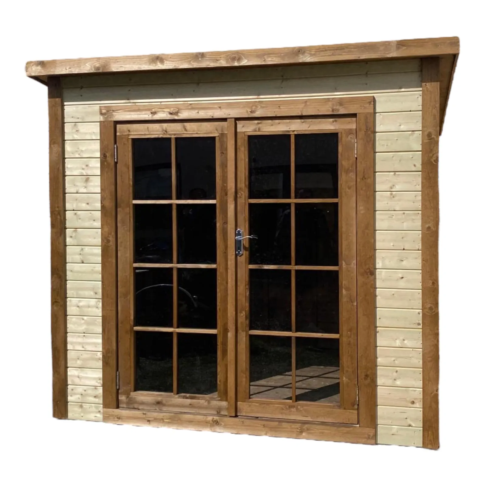 Front view of PENT shed with large glass double doors